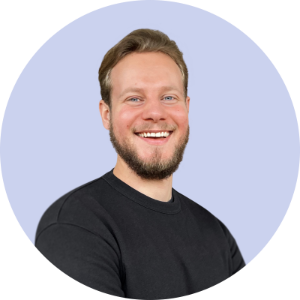 Remote headshot example of man smiling on light purple backdrop.